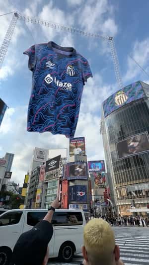 Football Jersey Hanging on Intersection in a fake-out-of-home ad of Santos FC