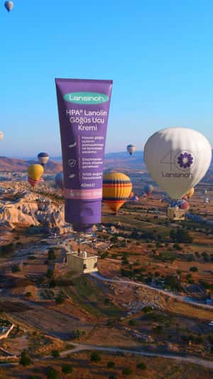 Floating Nipple Cream Hot Air Balloon in a fake-out-of-home ad of Lansinoh