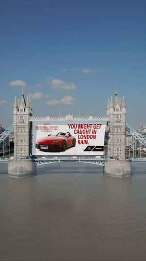Poster Rolls Down at Bridge in London in a fake-out-of-home ad of Mercedes