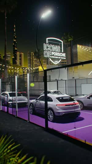 Cars Playing Tennis at Court in a fake-out-of-home ad of Porsche
