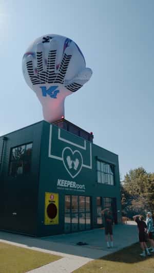 Glove Catches Ball at Building in a fake-out-of-home ad of KEEPERsports