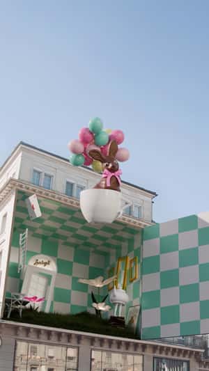 Cup Floats from Building in a fake-out-of-home ad of Confiserie Sprüngli