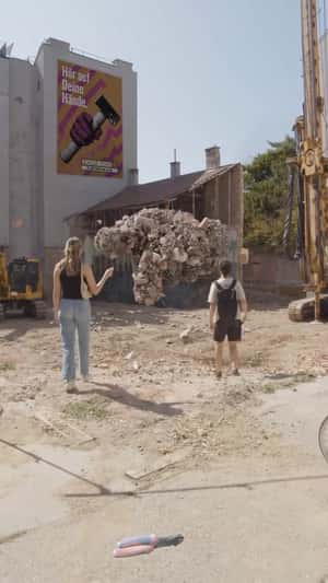 Stones Forming a Beckoning Hand in a fake-out-of-home ad of HORNBACH