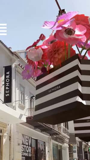 Bags Filled with Flowers on Conveyor in a fake-out-of-home ad of Sephora