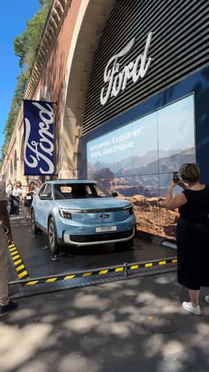 Flipping Car Display in a fake-out-of-home ad of Ford