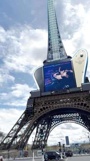 Electric Guitar on Eiffel Tower in a fake-out-of-home ad of Lenny Kravitz
