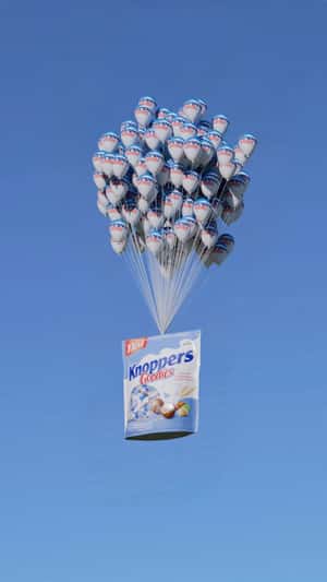 Chocolate Wafer Bag Carried by Balloons in a fake-out-of-home ad of Knoppers