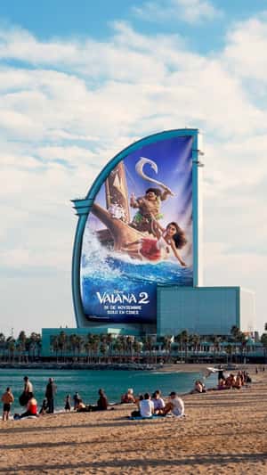 Movie Poster Rolls Down on Building in a fake-out-of-home ad of Disney