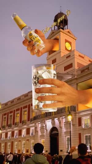 Hands Pouring a Drink at Building in a fake-out-of-home ad of Royal Bliss
