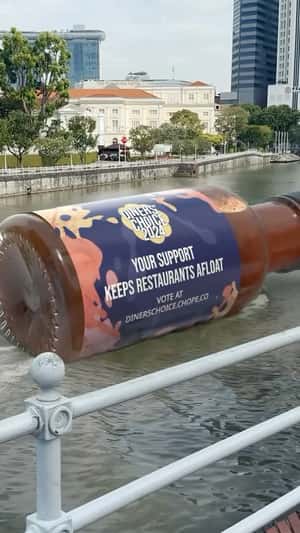 Chili Sauce Bottle Floating on River in a fake-out-of-home ad of Chope