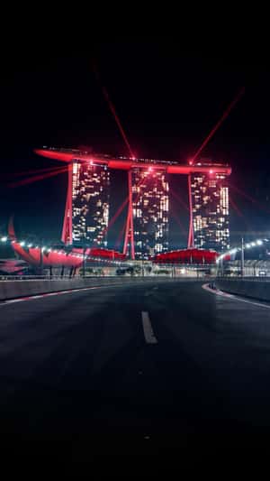 Race Track Emerges on River in a fake-out-of-home ad of Marina Bay Sands