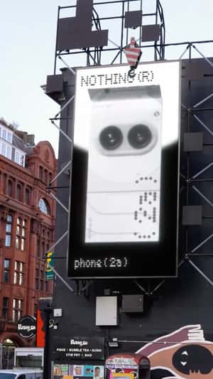 Phone Unboxing by a Towing Crane in a fake-out-of-home ad of Nothing