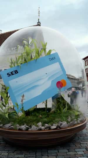 Debit Card Inside Terrarium in a fake-out-of-home ad of SEB