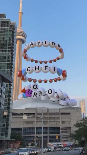 Letter Bead Bracelets Drop on Stadium in a fake-out-of-home ad of 98.1 CHFI