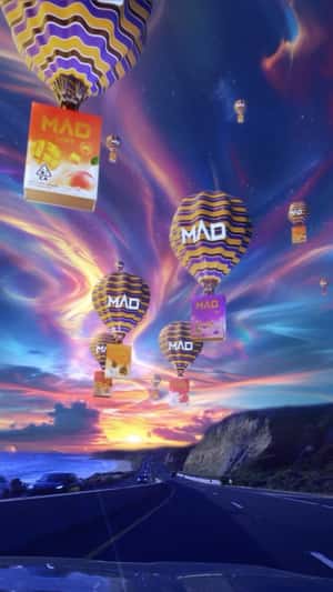 Hot Air Balloons with Vape Packages in a fake-out-of-home ad of MAD Labs