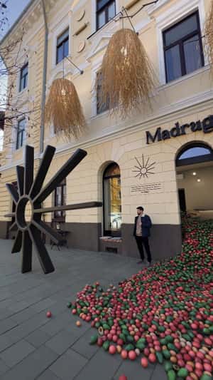 Wooden Logo Rolls on the Street in a fake-out-of-home ad of Madrugada