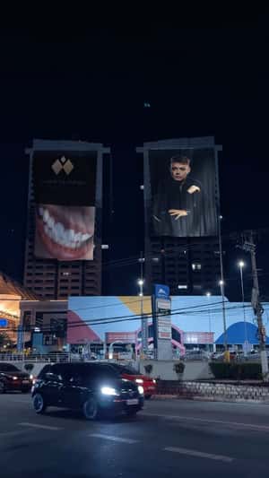 Billboards Waving on Buildings in a fake-out-of-home ad of Dr. Toni Amaral