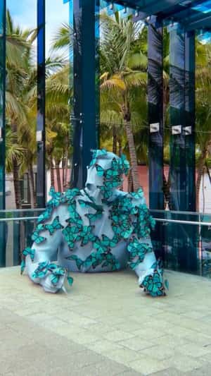 Sculpture Covered with Butterflies in a fake-out-of-home ad of Miami Design District