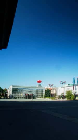 Inflatable Red Lips Between Buildings in a fake-out-of-home ad of Smile