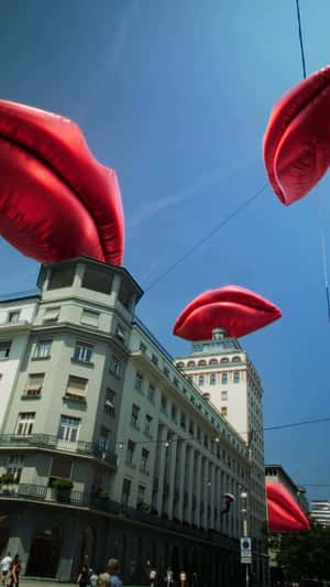 Inflatable Red Lips Above the Bank in a fake-out-of-home ad of Smile