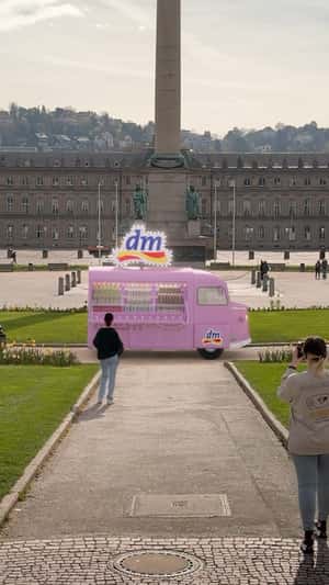 Pink ice cream truck with at Schlossplatz Stuttgart in fake-out-of-home ad of DM