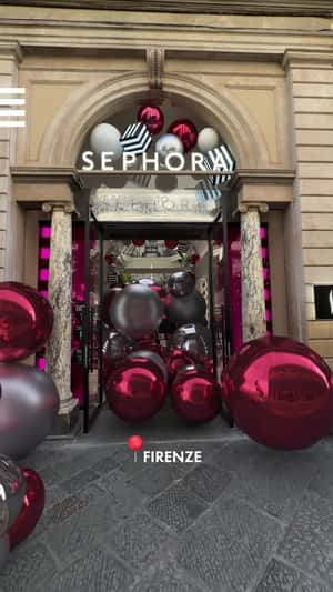 Christmas Balls Roll in Different Streets in a fake-out-of-home ad of Sephora