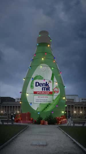 Giant Denkmit dishwashing conditioner in fake-out-of-home ad of DM