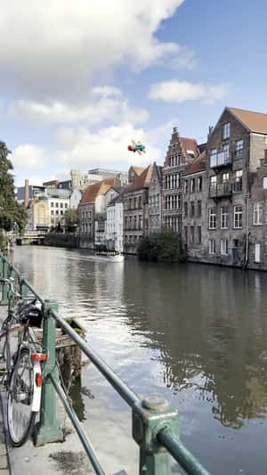 Toy Airplane Flies Over the Canal in a fake-out-of-home ad of HEMA