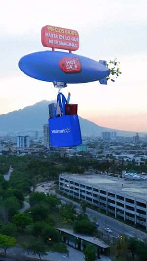 Airship with Shopping Bag Releases Coupons in a fake-out-of-home ad of Walmart