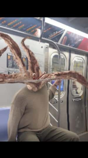 Parasyte Enter Man’s Ear in a fake-out-of-home ad of Netflix