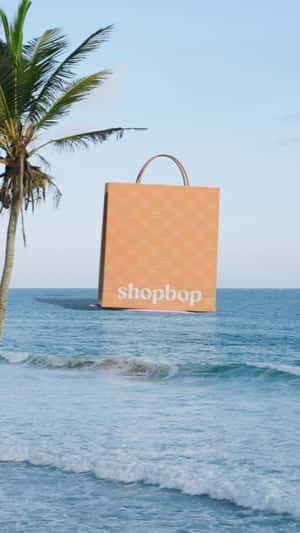 Shopping Bag Drags by a Speedboat in a fake-out-of-home ad of Shopbop
