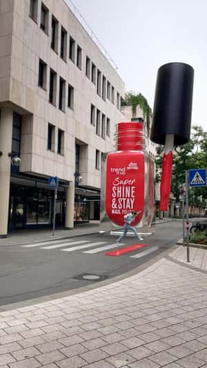 Giant DM Super Shine & Stay Nail Polish in fake-out-of-home ad of DM