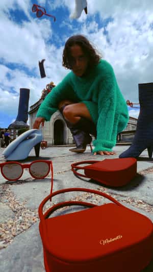 Fashion Items Rain Down in a fake-out-of-home ad of Shopbop