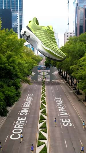 Running Shoe Glides Above Runners in a fake-out-of-home ad of Under Armour