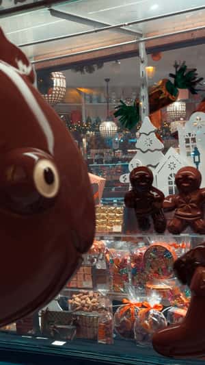 Dancing Chocolates at Store in a fake-out-of-home ad of À La Mère de Famille