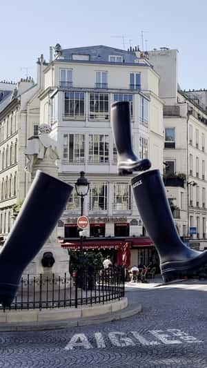Black Boots Rain Down on the Street in a fake-out-of-home ad of Aigle