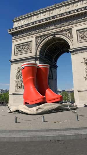 Red Boots Unveiled at Arc de Triomphe in a fake-out-of-home ad of Aigle
