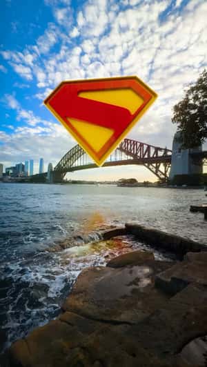 Glowing Logo Rises from Harbour in a fake-out-of-home ad of Superman