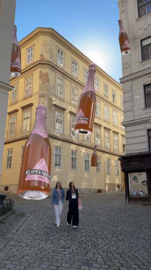 Woman Grabs Floating Wine in a fake-out-of-home ad of Kupferberg Sekt