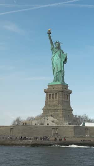 Pixelated Statue of Liberty on Screen in a fake-out-of-home ad of WhatsApp