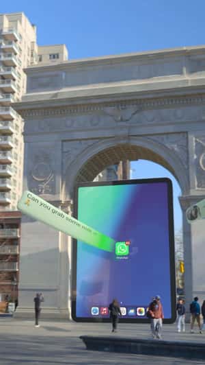 Message Bubbles Flow into the iPad in a fake-out-of-home ad of WhatsApp