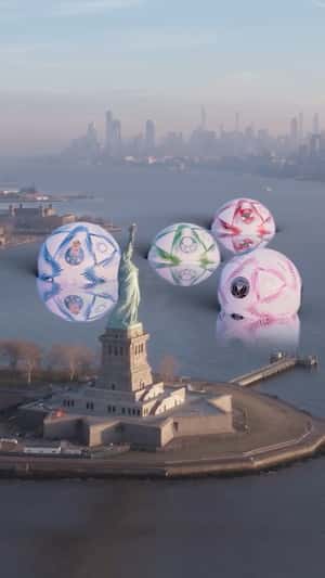 Soccer Balls Drop Near Statue of Liberty in a fake-out-of-home ad of FC Porto