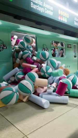 Train Loaded with Cosmetics and Balls in a fake-out-of-home ad of Fenty Beauty