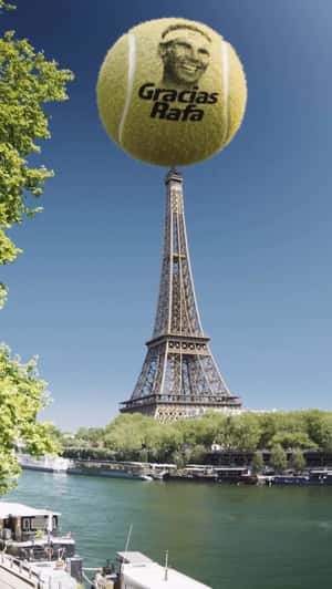 Tennis Ball Spins on Top of Eiffel Tower in a fake-out-of-home ad of Babolat