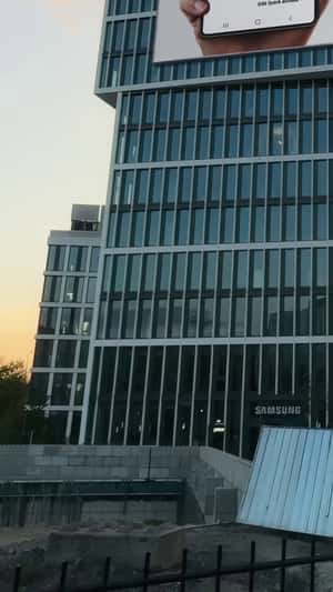 Crane Places Bank Card on Billboard in a fake-out-of-home ad of Samsung