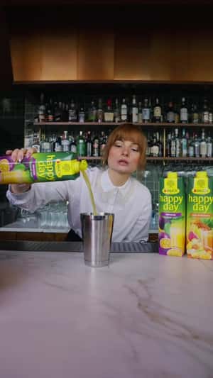 Fruits Emerge from Cup to City in a fake-out-of-home ad of Rauch Happy Day