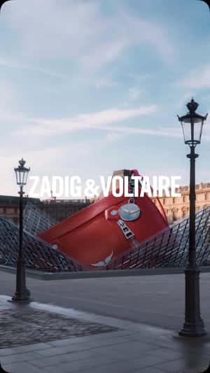 Red Bag Ascends at Glass Pyramid in a fake-out-of-home ad of Zadig&Voltaire