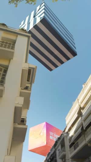 Gift Boxes Floats Above Buildings in a fake-out-of-home ad of Sephora