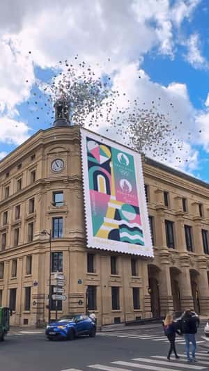 Stamp Rolls Down on Postal Office in a fake-out-of-home ad of La Poste