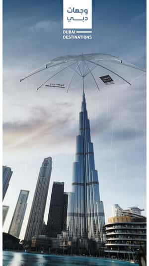 Clear Umbrella Opens Above the Building in a fake-out-of-home ad of BrandDubai